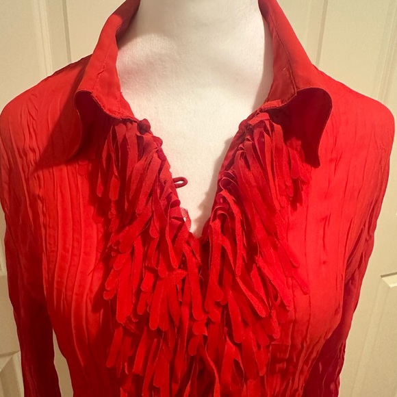 Adorable red long sleeved button up blouse with fringe on front and cuffs. - Picture 3 of 4